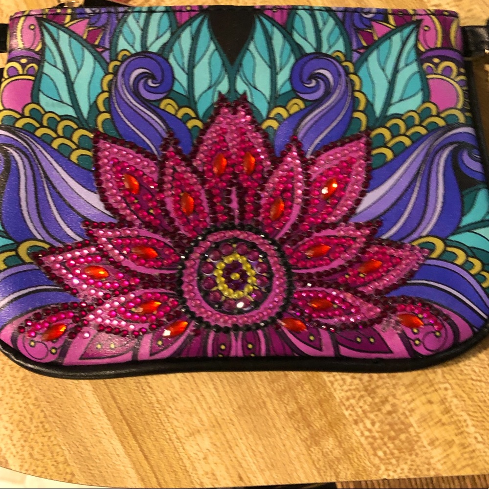 Cute bag can be used as a make up bag a traveling bag or a purse